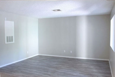 Living room with carpet and slider doors