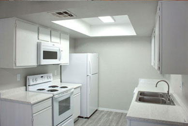 Modern kitchen with white cabinets and built-in appliances